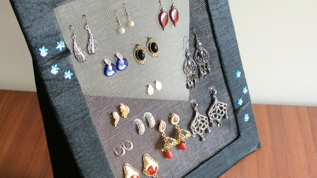This is a very simple idea to have a earring organizer with just cardboard, glue and a net