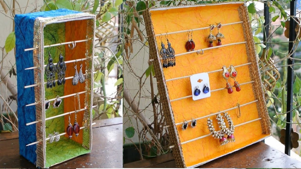 Materials used - waste boxes, glue, colorful hand made paper, barbecue wooden sticks, decorative lace