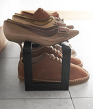 Yamazaki's Simple black shoe rack filled with shoes, seen from the side and up close.